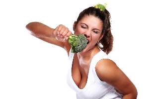woman-playfully-eating-raw-broccoli
