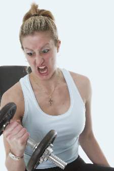intense-women-looking-at-dumbbell